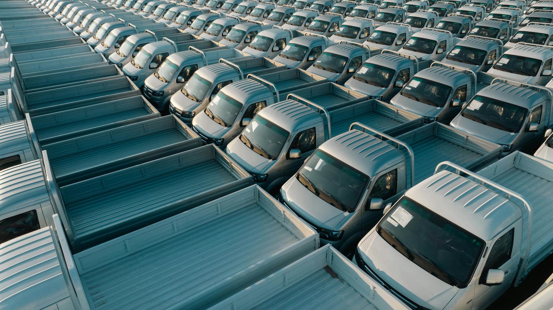 aerial view of a fleet of silver pickup trucks